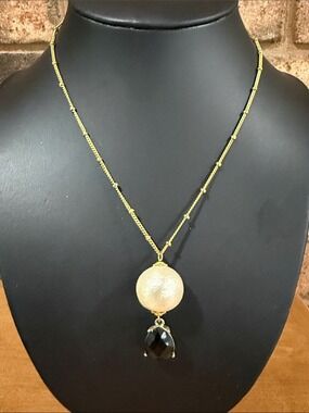 Vintage Artisan gold tone necklace with white and black drop pendant